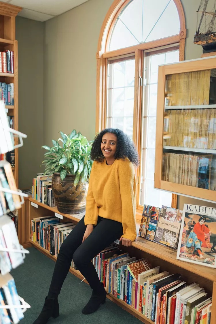 The author smiles at the camera.