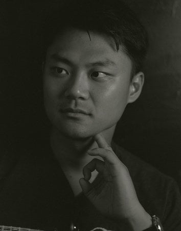 A portrait of the author Yiming Ma in black and white