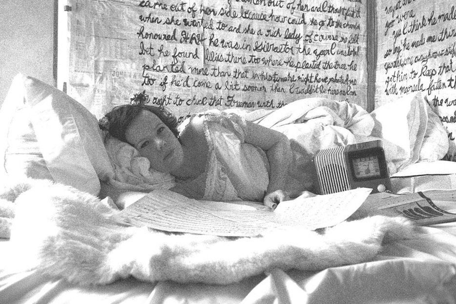 ||Caraid O’Brien, who every Bloomsday performs Molly Bloom's monologue for Radio Bloomsday, in her Ulysses-papered bedroom.