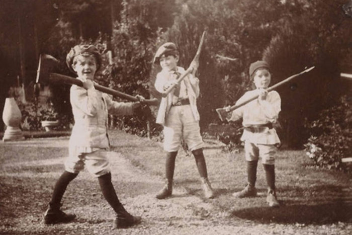 |George, John and Peter Llewelyn Davies in The Boys Castaways—a picture book made by J.M Barrie of the boys’ adventures during the summer of 1901.
