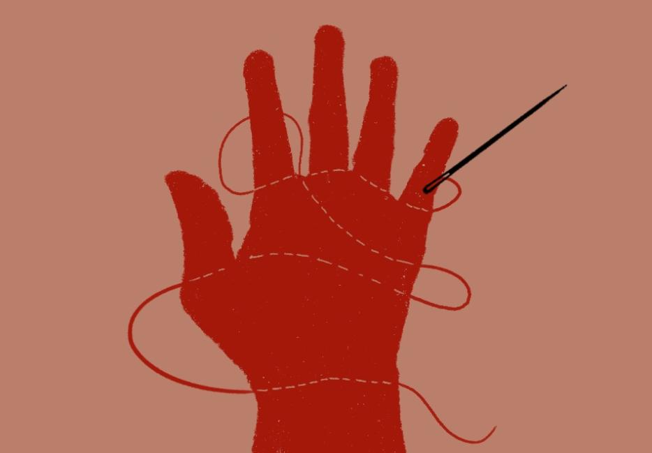 A red hand on a beige background, stitched through with thread. The needle rests on the pinkie finger 