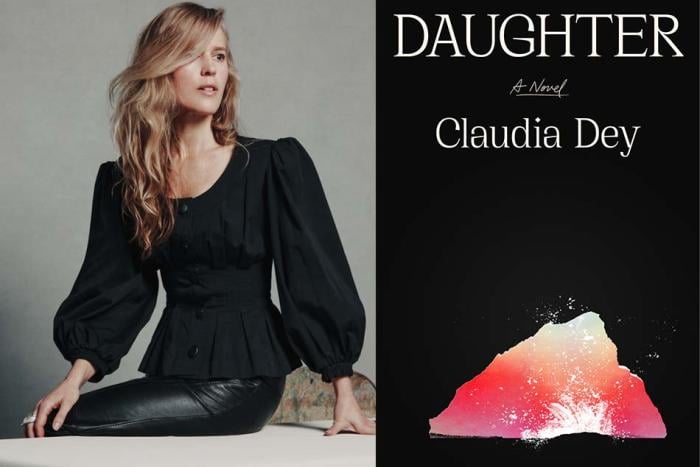 An image of author Claudia Dey, in a black blouse and black leather pants, sitting on a table, beside the cover of her book Daughter