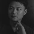 A portrait of the author Yiming Ma in black and white 